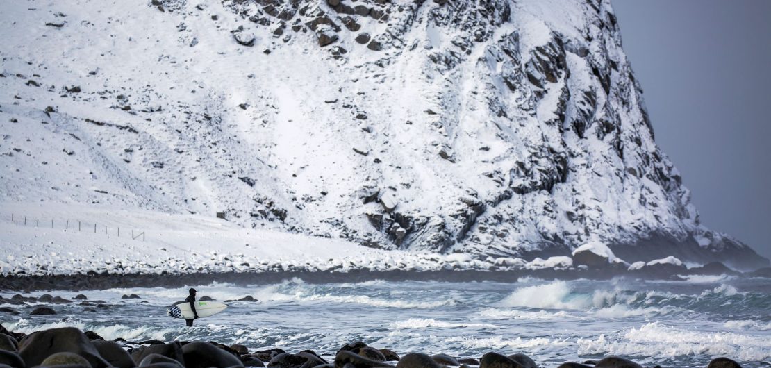 Surfer going into a freezing lineup