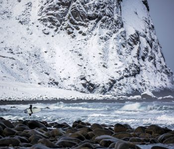 Surfer going into a freezing lineup